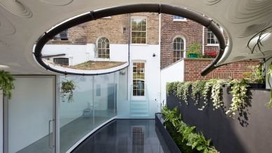 Architects deliberately left a hole in the roof of this extraordinary rear extension