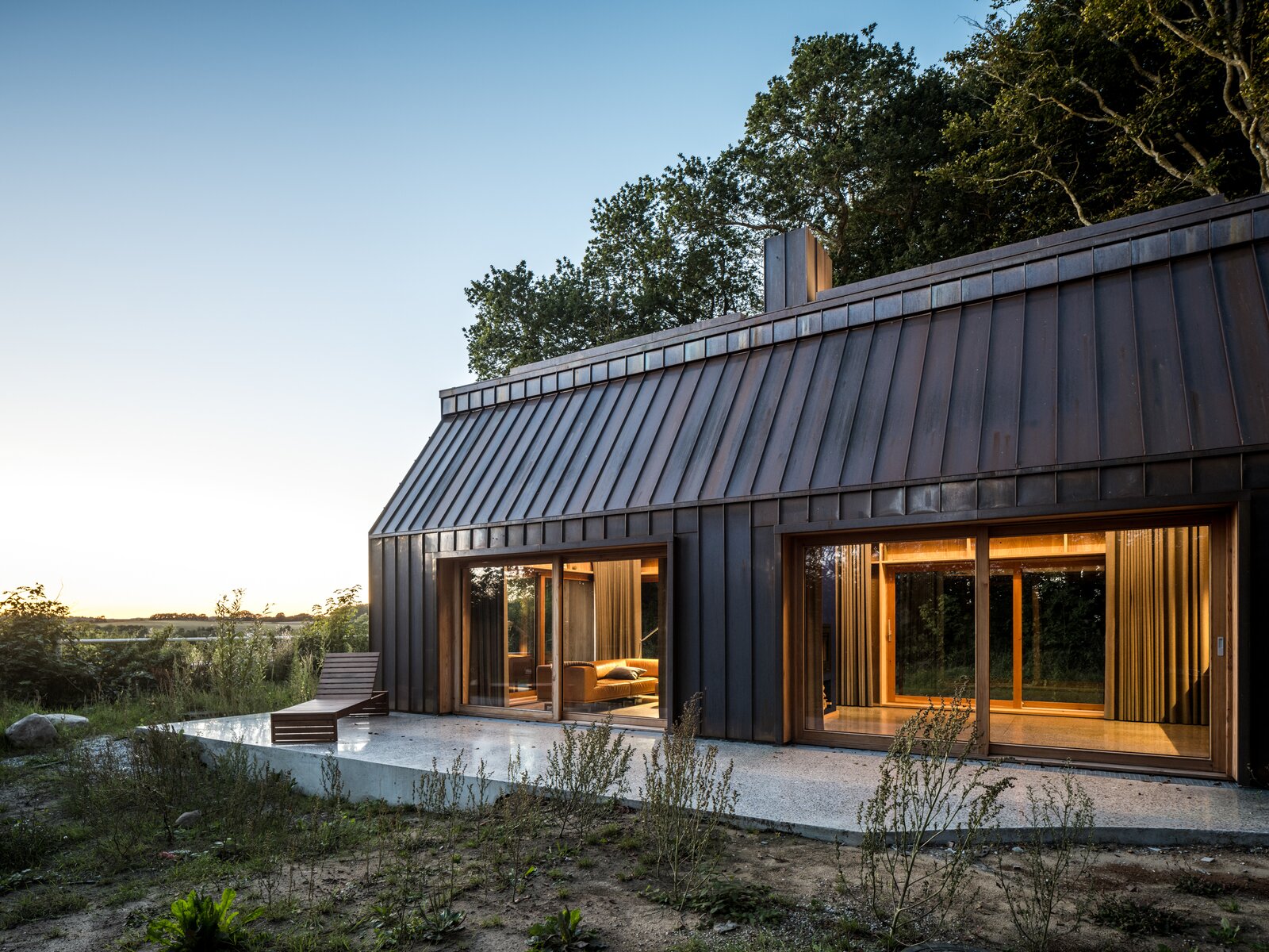 A Writer’s Copper-Clad Live/Work Space Blends Into the Forest in Denmark
