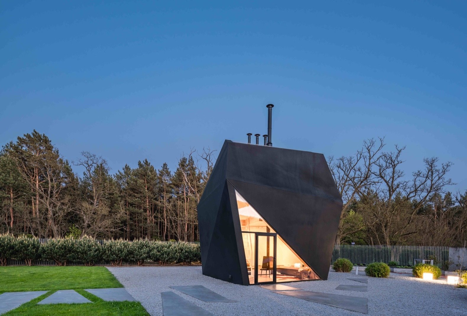 A Family in Poland Adds an Origami-Inspired Retreat to Their Backyard